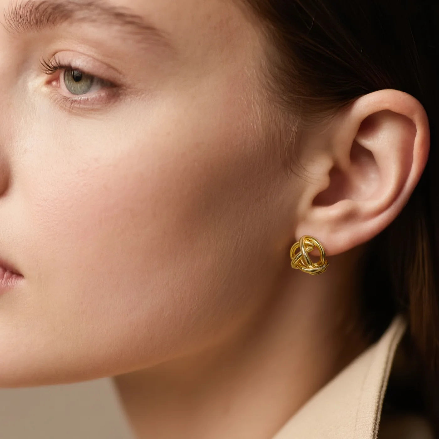 Woven Knot Gold Stud Earrings lifestyle image